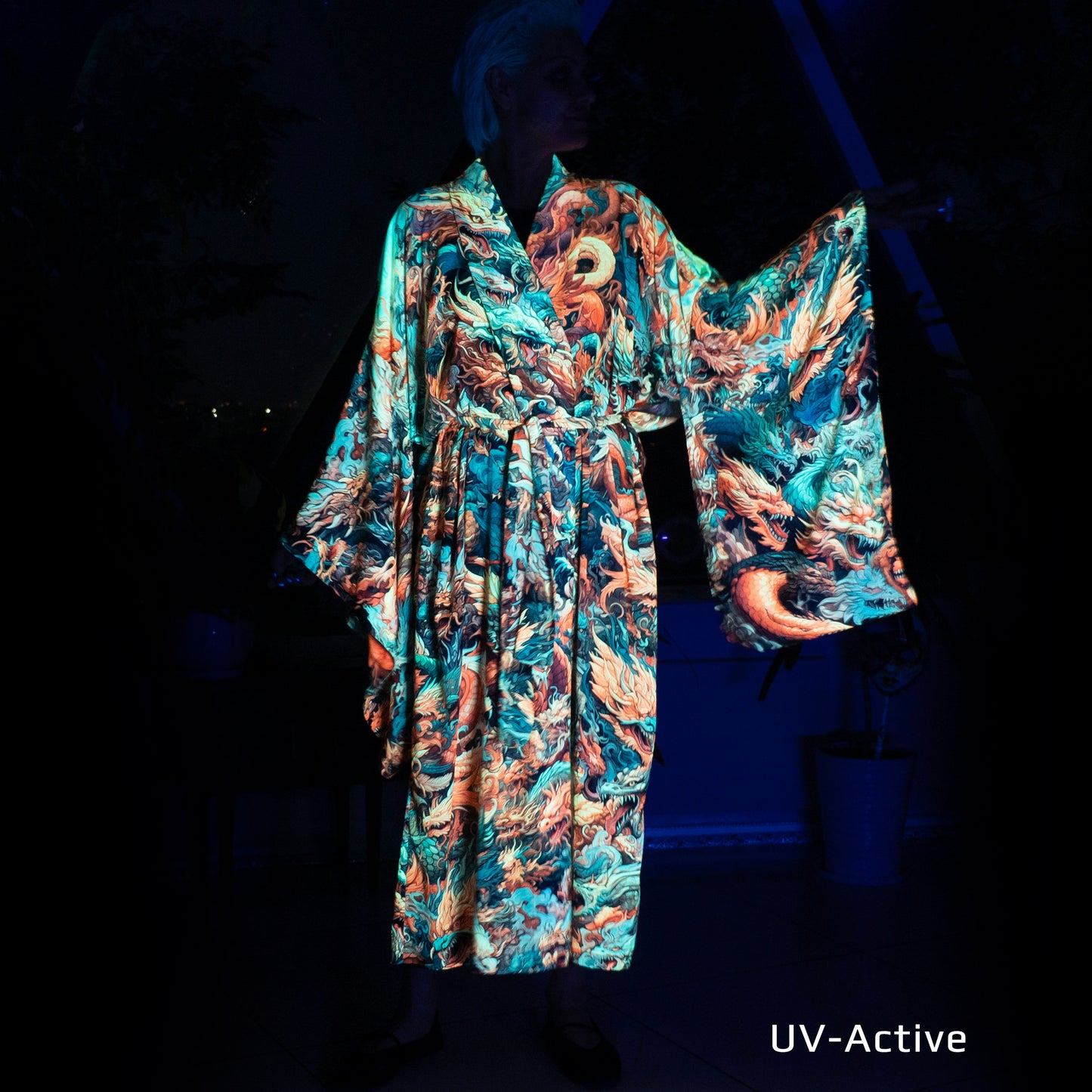 A blacklight reactive kimono featuring a fierce Asian dragon design, perfect for raves and festivals.
